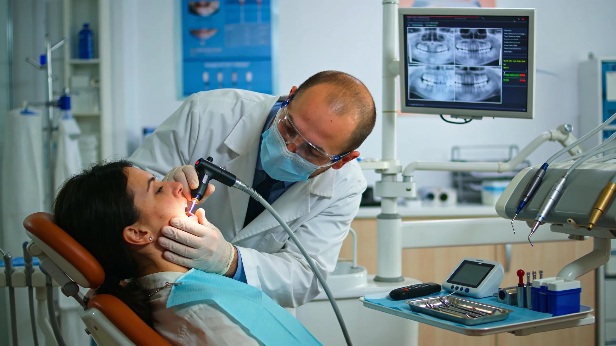 Dentist providing emergency dental care in a modern clinic setting